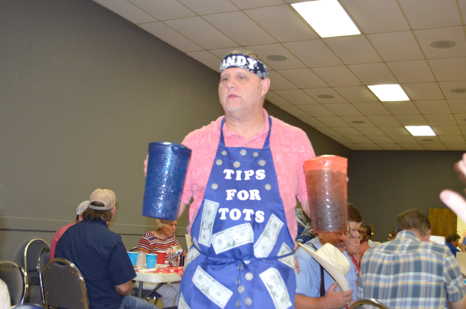 Randy Osborne with New Hope Baptist Church serves tea and water to diners.
